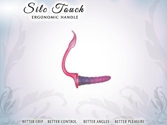 Pic shows a vertical, elegantly curved handle with a dildo at the base, perpendicular to the handle. The base of the handle has a 2.75" wide platform for a suction cup dildo to attach. The handle is as long as the dildo. Top of pic says Silc Touch ergonomic handle. Bottom say Better grip, better control, better angles, better pleasure.