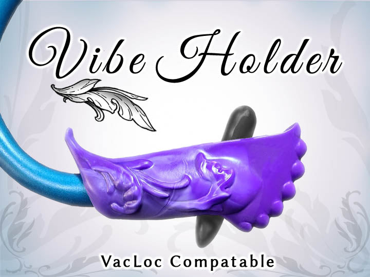 A purple silicone vibe holder with a decorative design, compatible with Vac-u-Lock systems, shown with a blue handle inserted.